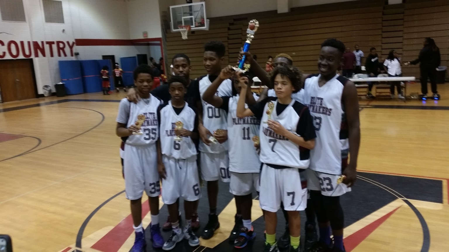Elite Playmakers 2016 team with trophies